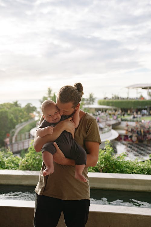 Father Kissing his Baby on the Cheek