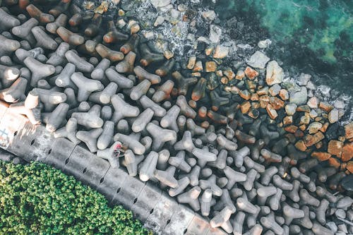 Breakwater construction on rocky sea coast