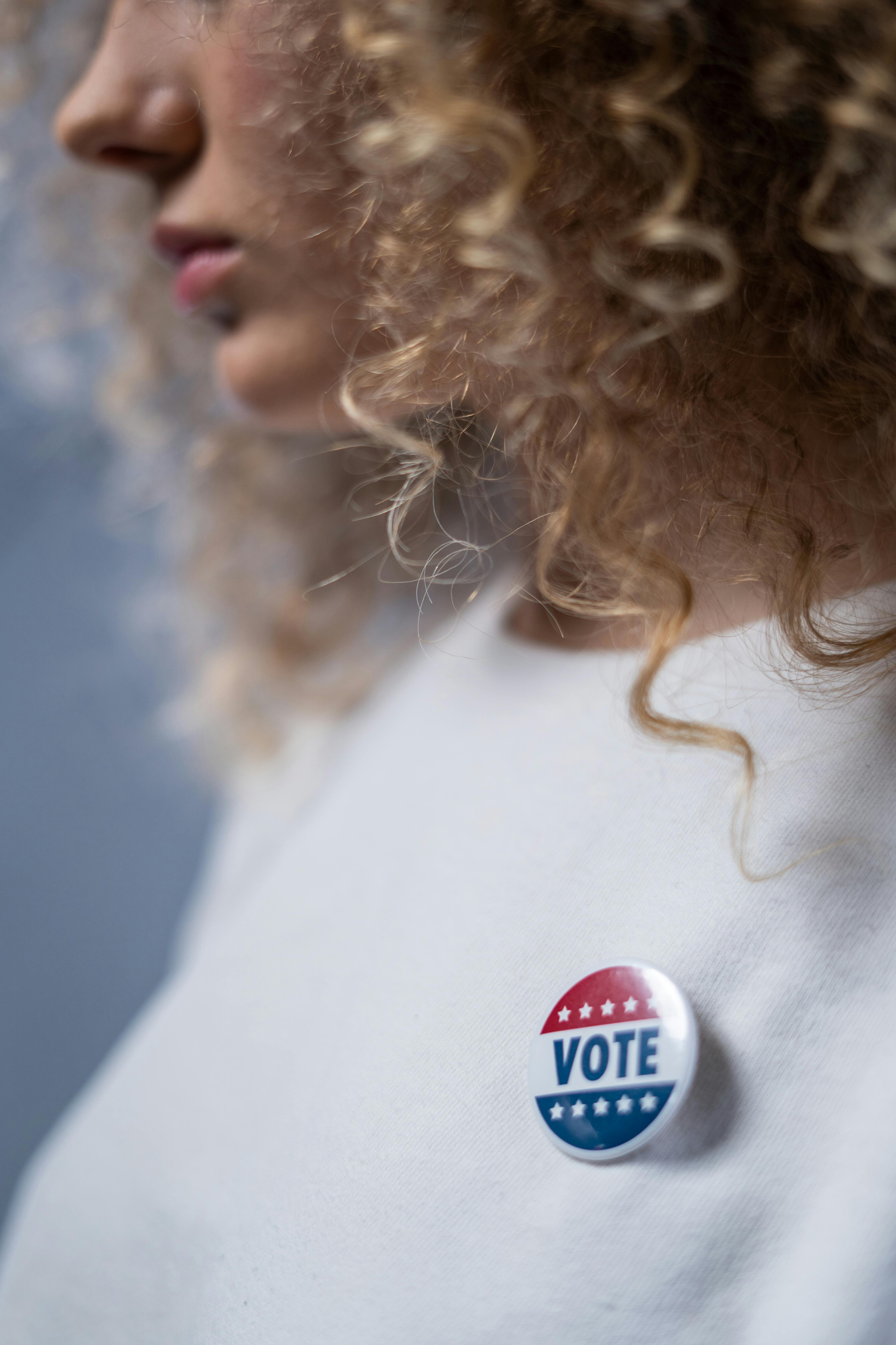 woman with a vote pin