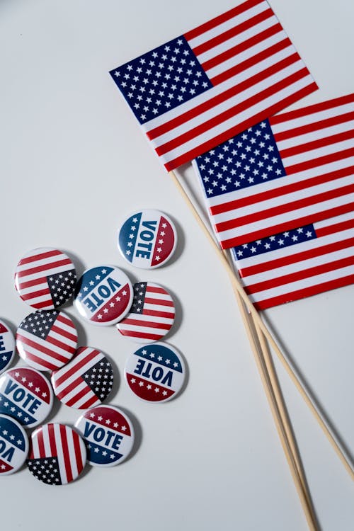Free American Flags and Pins on White Background Stock Photo