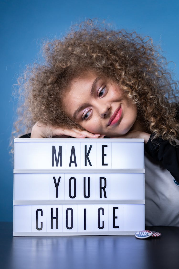 Smiling Woman With A Sign