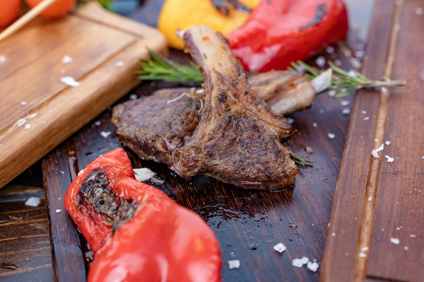 Grilled lamb chops with roasted red peppers and rosemary, a classic pairing for Ribera del Duero and Rioja Tempranillo