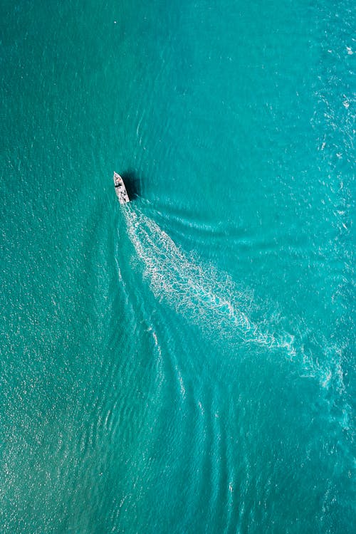 Drone view of yacht sailing in sea water