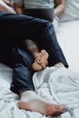 Person in Blue Denim Jeans Lying on Bed