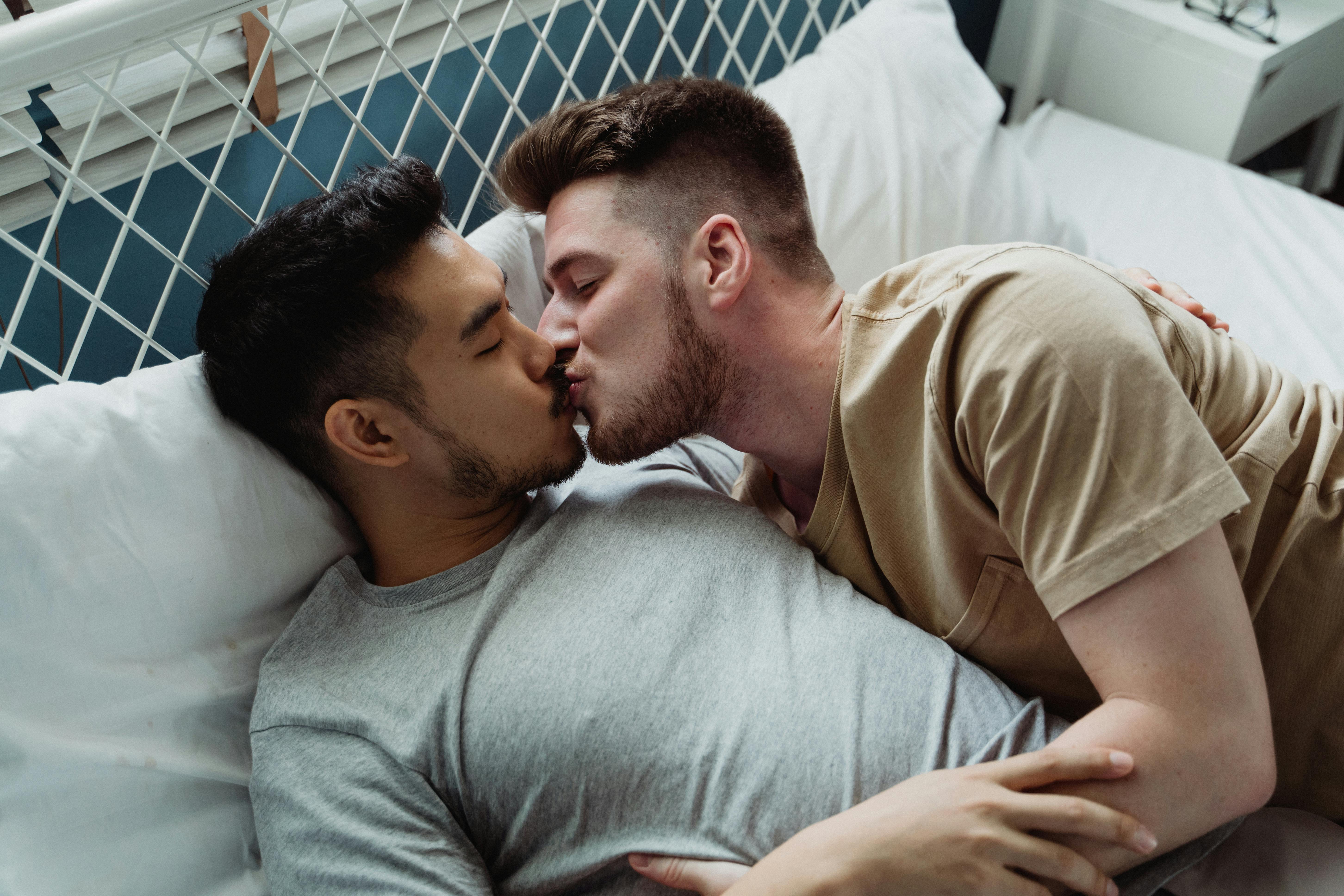 Two Men Kissing in Bed · Free Stock Photo image picture