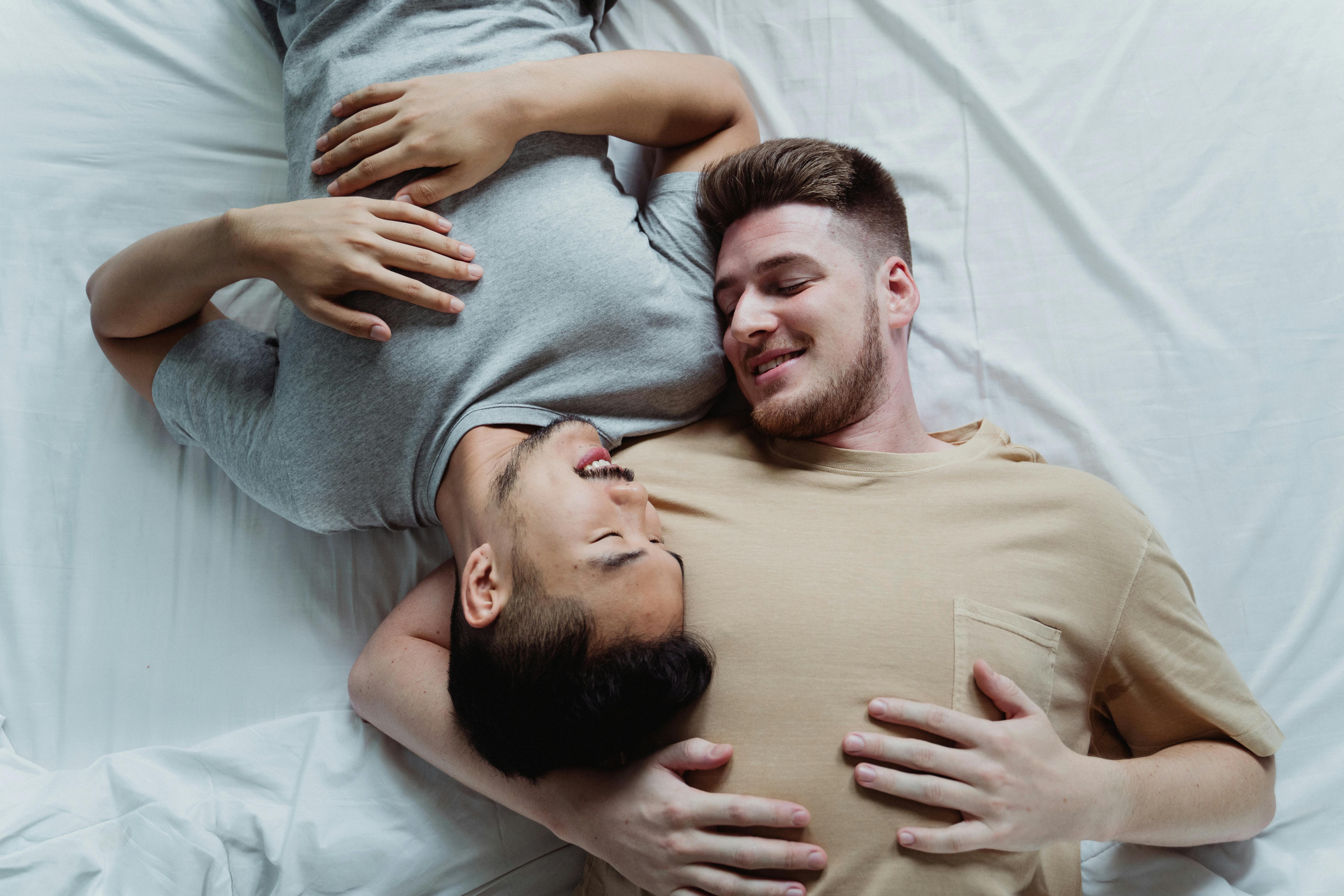 two men lying down together