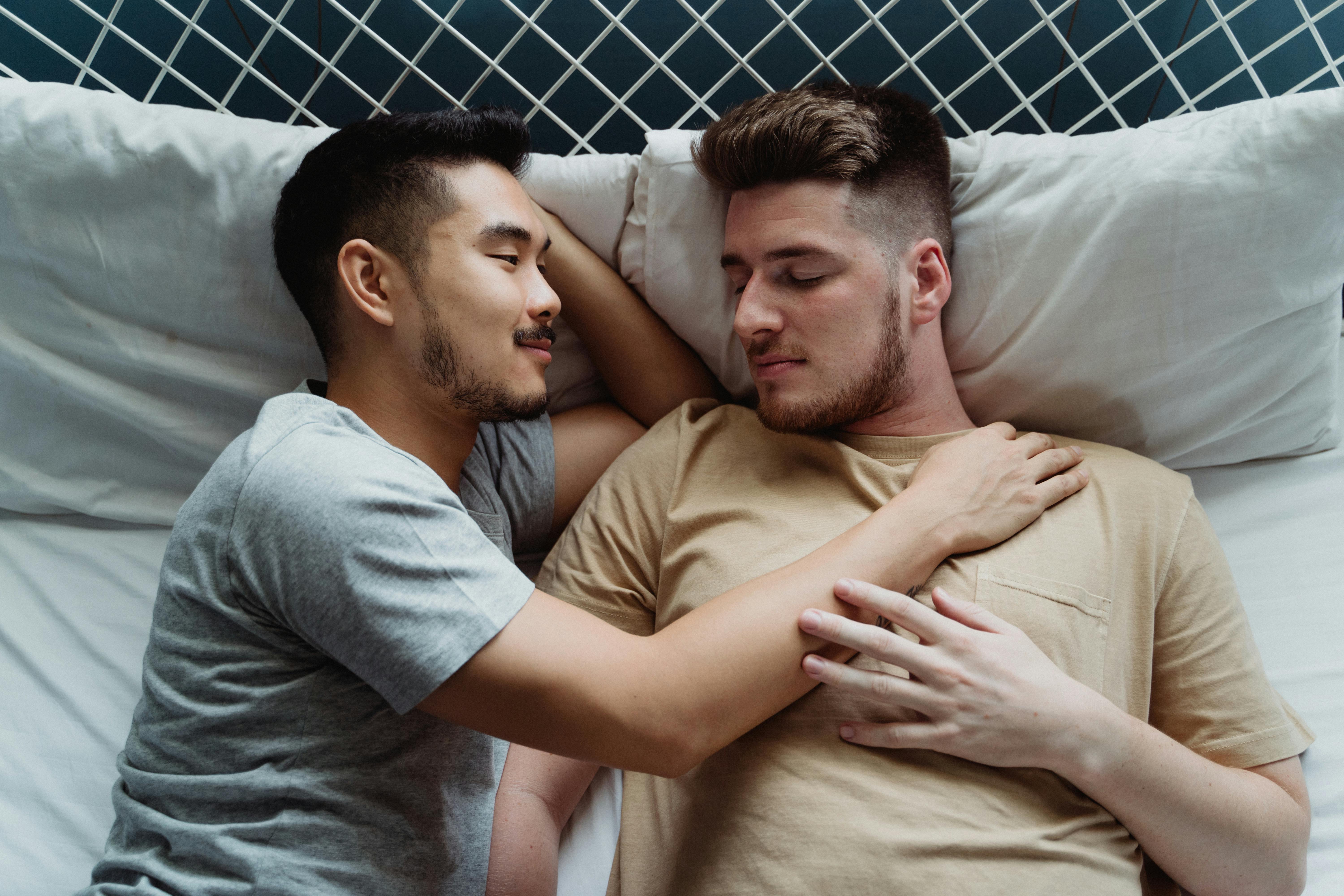 Two Men Lying Together in Bed · Free Stock Photo