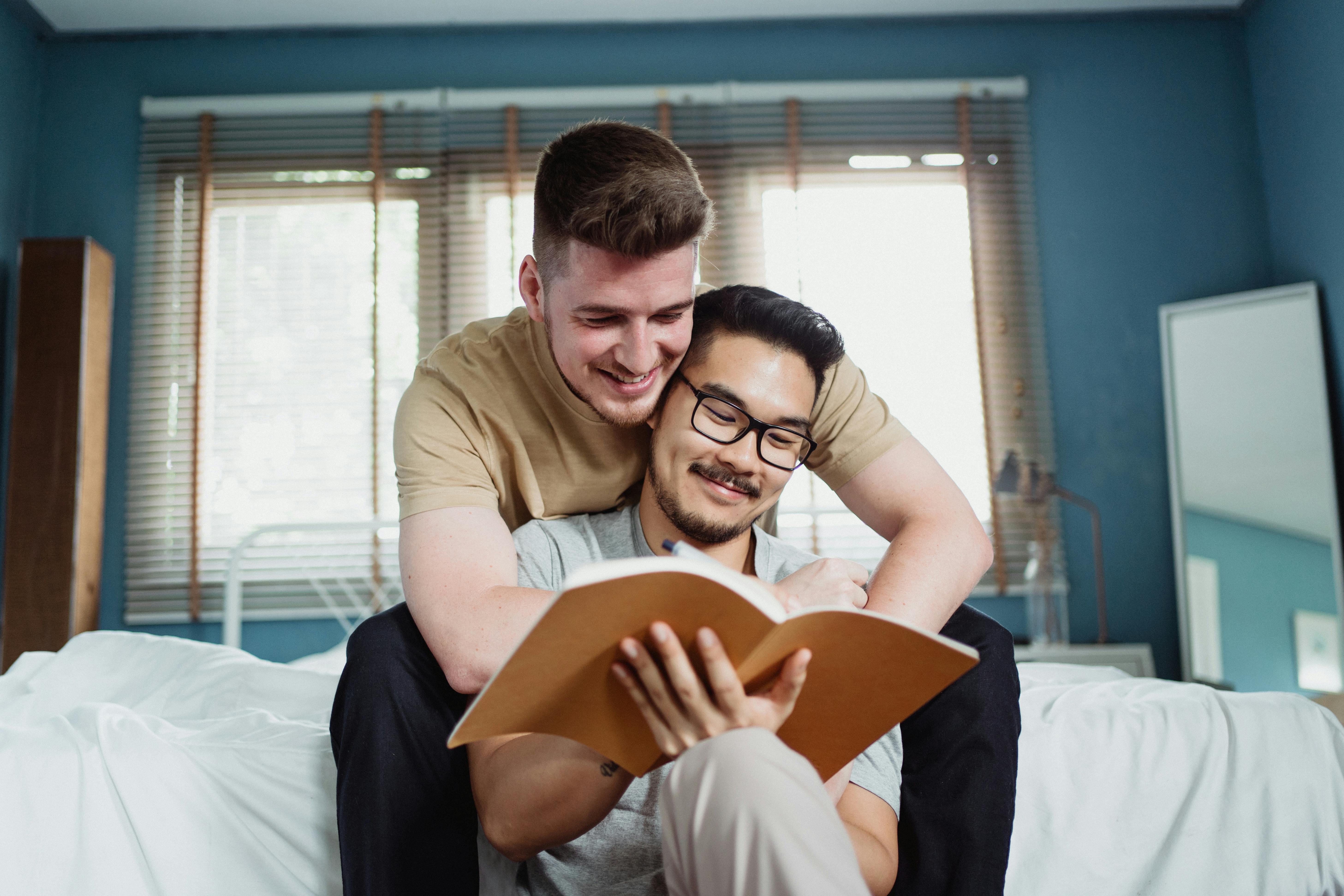 two men reading a book