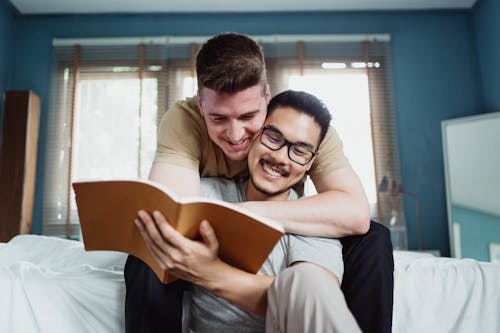 Free Man Being Embraced by Another Man Stock Photo