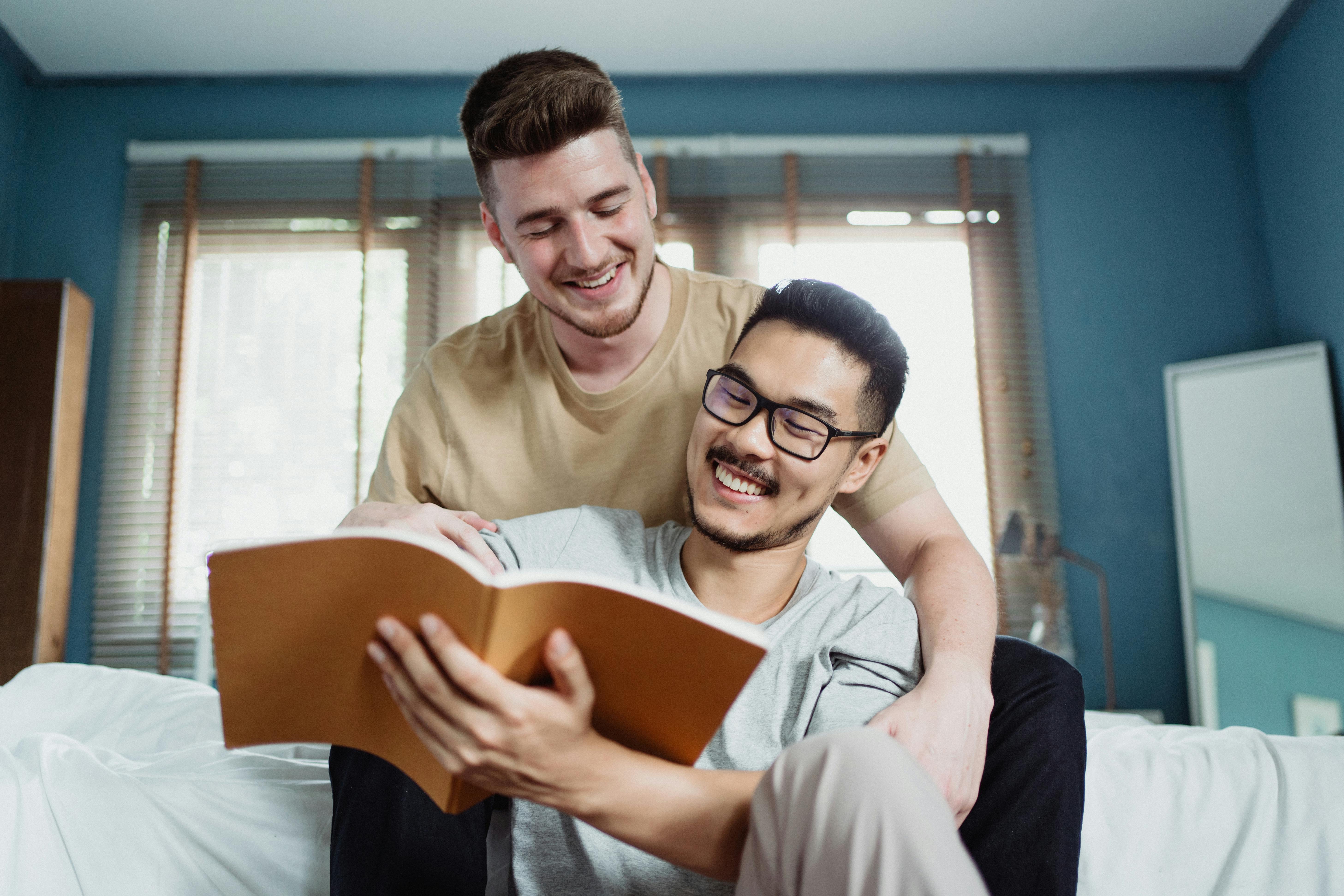 two men reading a book