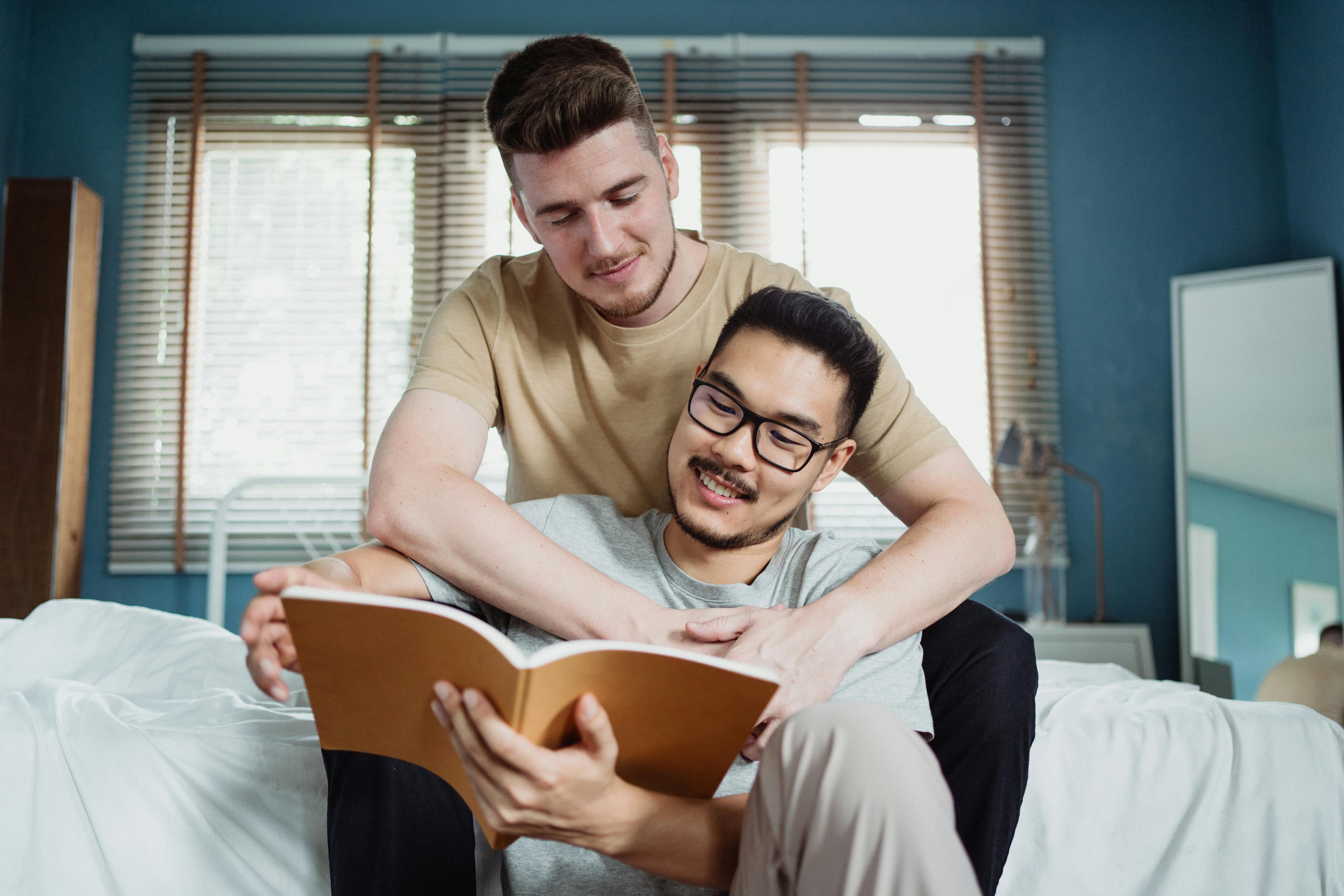 two men reading a book