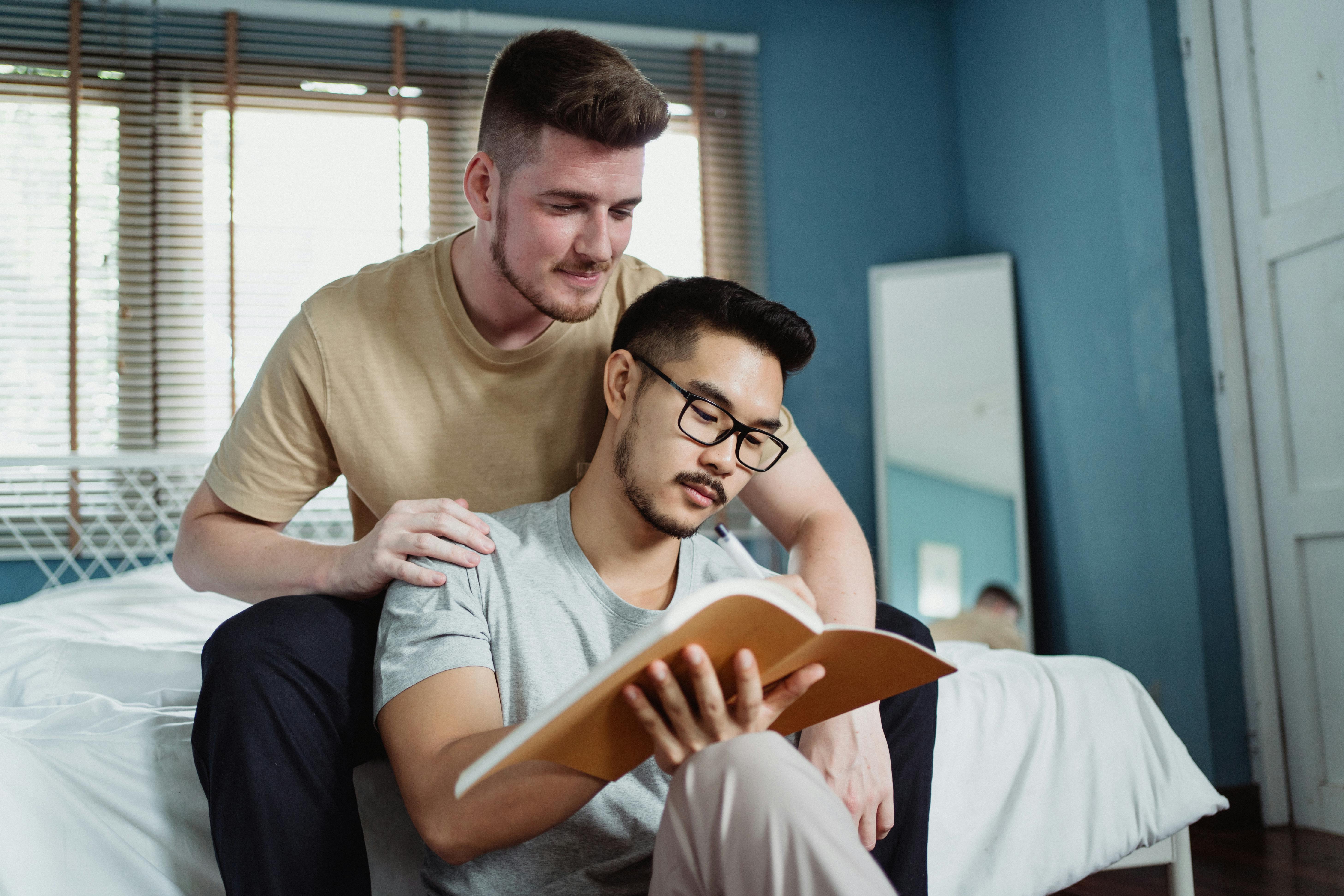 two men reading a book