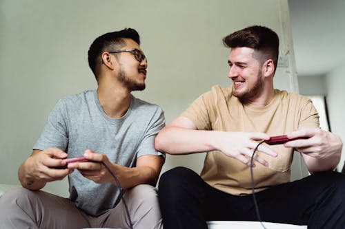 Men Playing Video Game Together