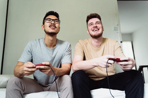Free Men Playing Video Game Together Stock Photo