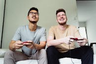 Men Playing Video Game Together