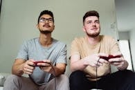 Men Playing Video Game Together