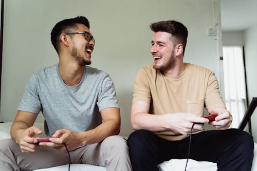 Free Men Playing Video Game Together Stock Photo