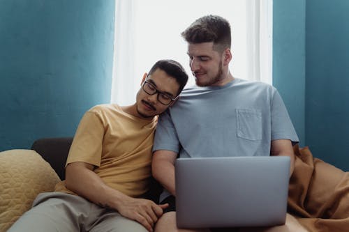 Man Resting his Head on Another Man's Shoulder