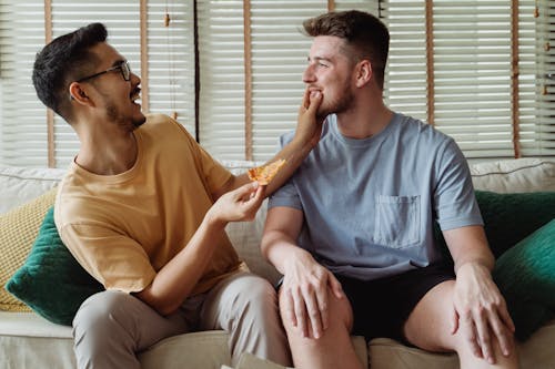 Man Touching Another Man's Face