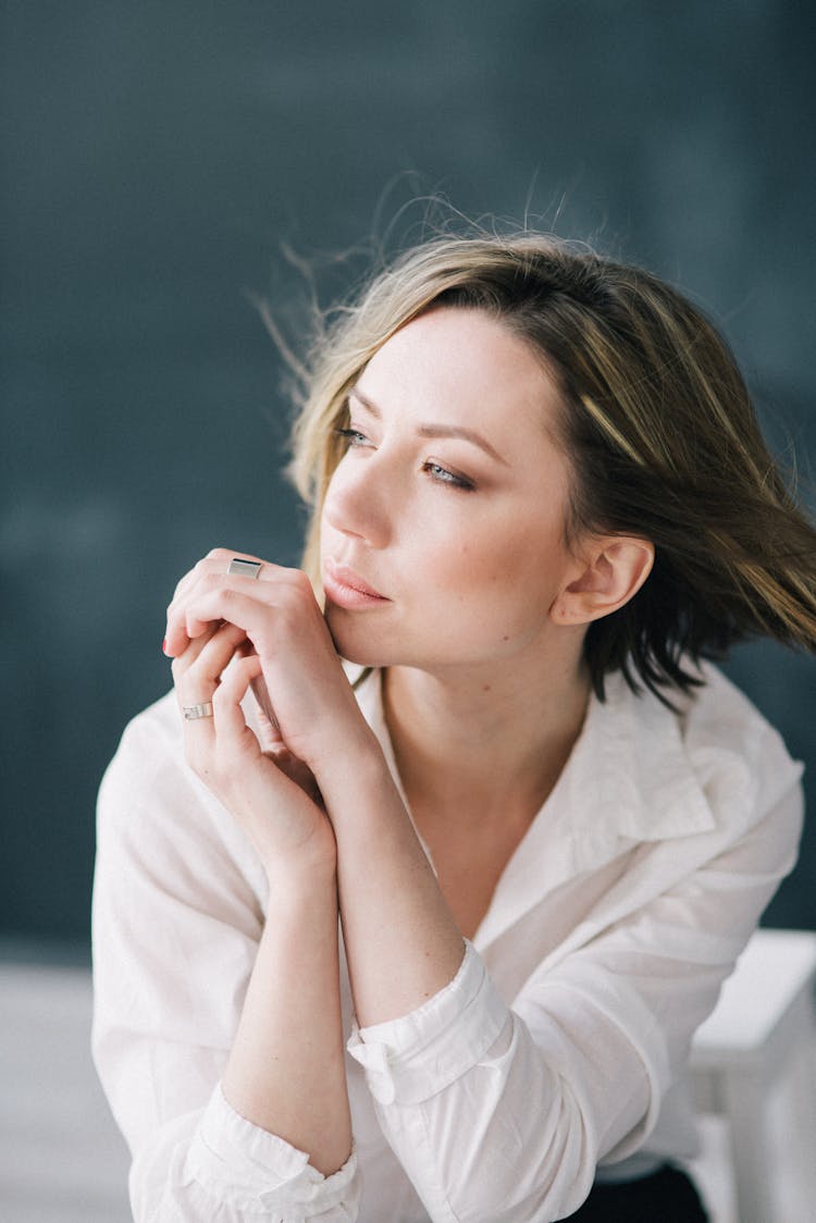 Woman In White Button Down Shirt Looking Away