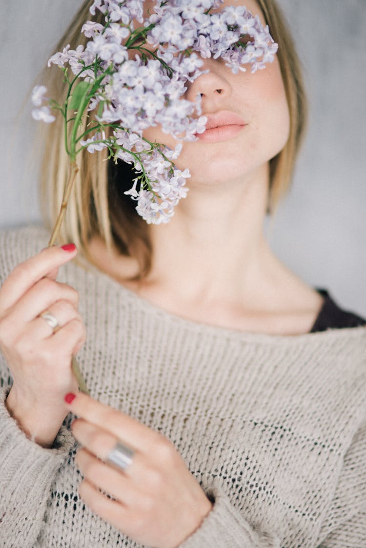 Lilac Flowers Covering The Woman's Half Face