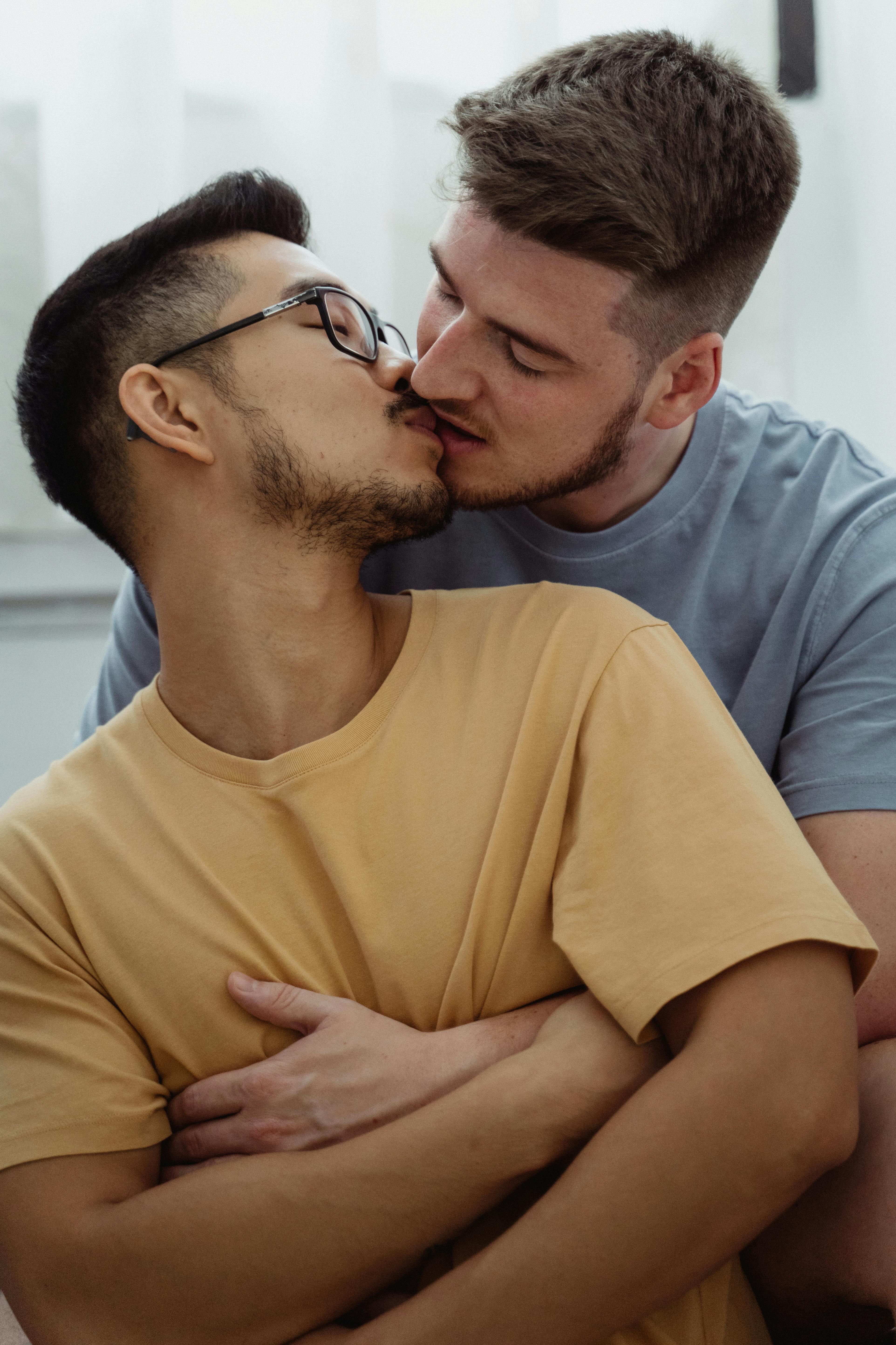 two gay men kissing full body