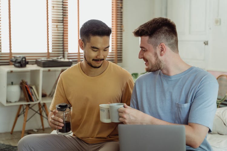 Bearded Men Holding White Ceramic Mugs