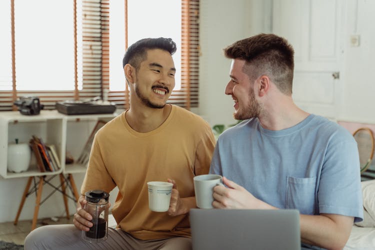 Men Enjoying Their Cup Of Coffee