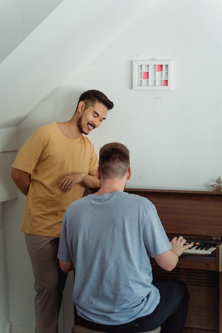 Back View Of A Person Playing Piano