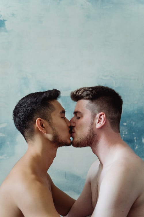 Free Two Shirtless Men Kissing  Stock Photo