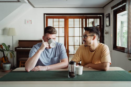 Men Sitting and Drinking Coffee