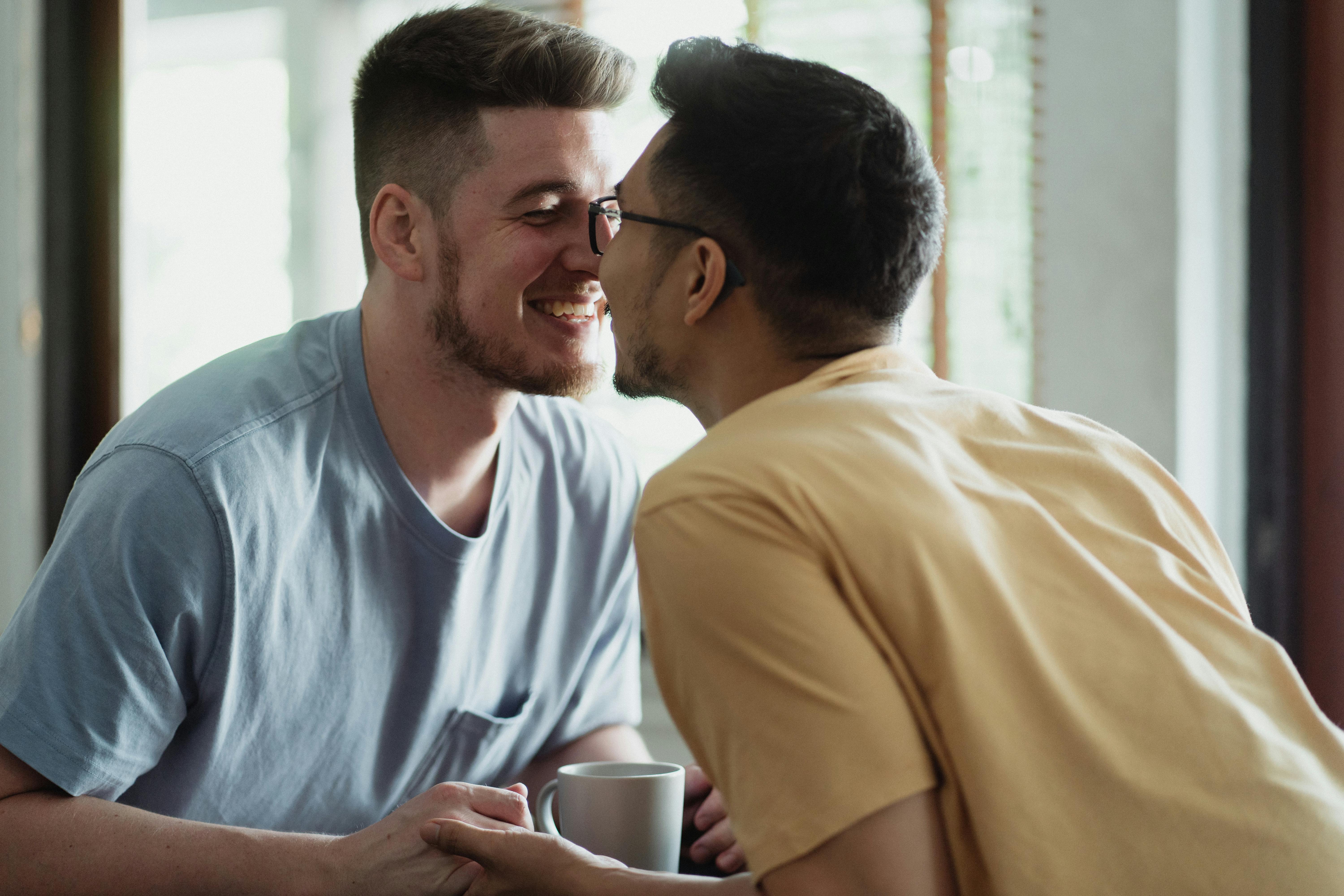 two men holding hands