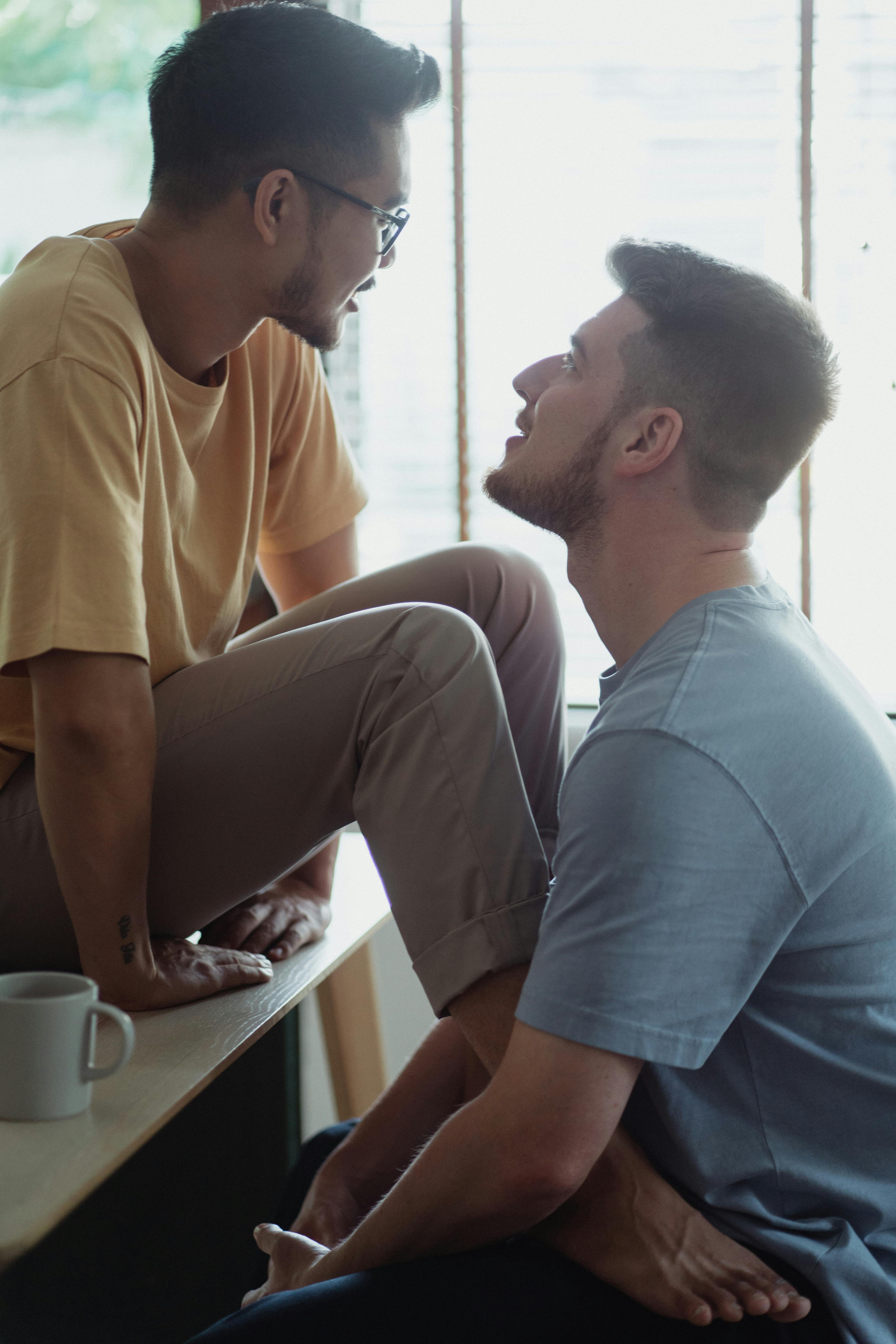 a couple sitting while facing each other