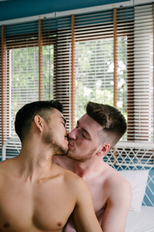 Free Two Topless Men Kissing Stock Photo