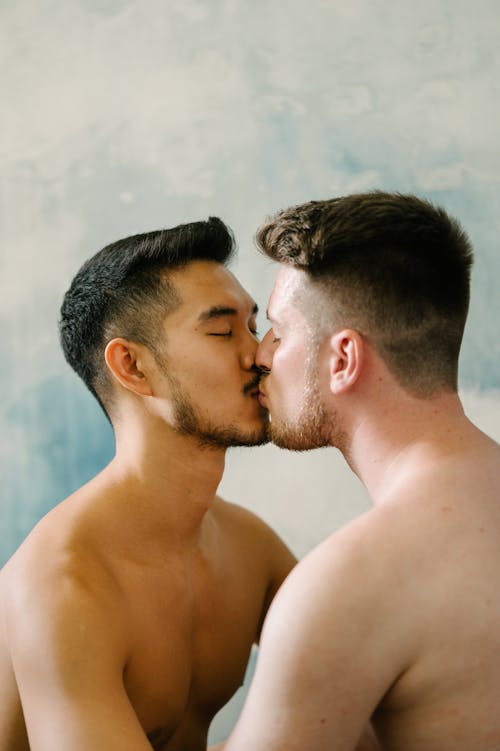 Free Two Shirtless Men Kissing Stock Photo