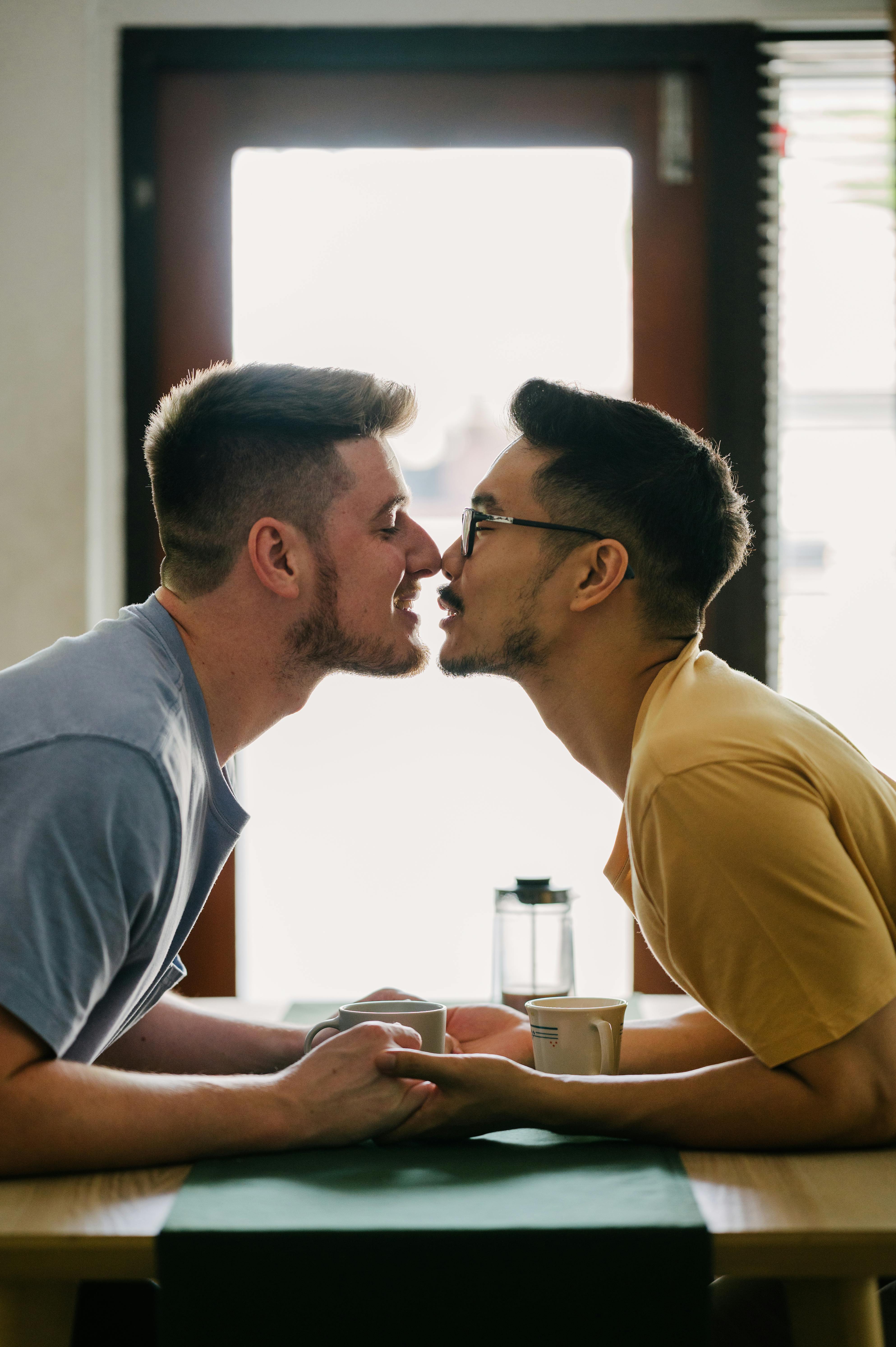 two men holding hands