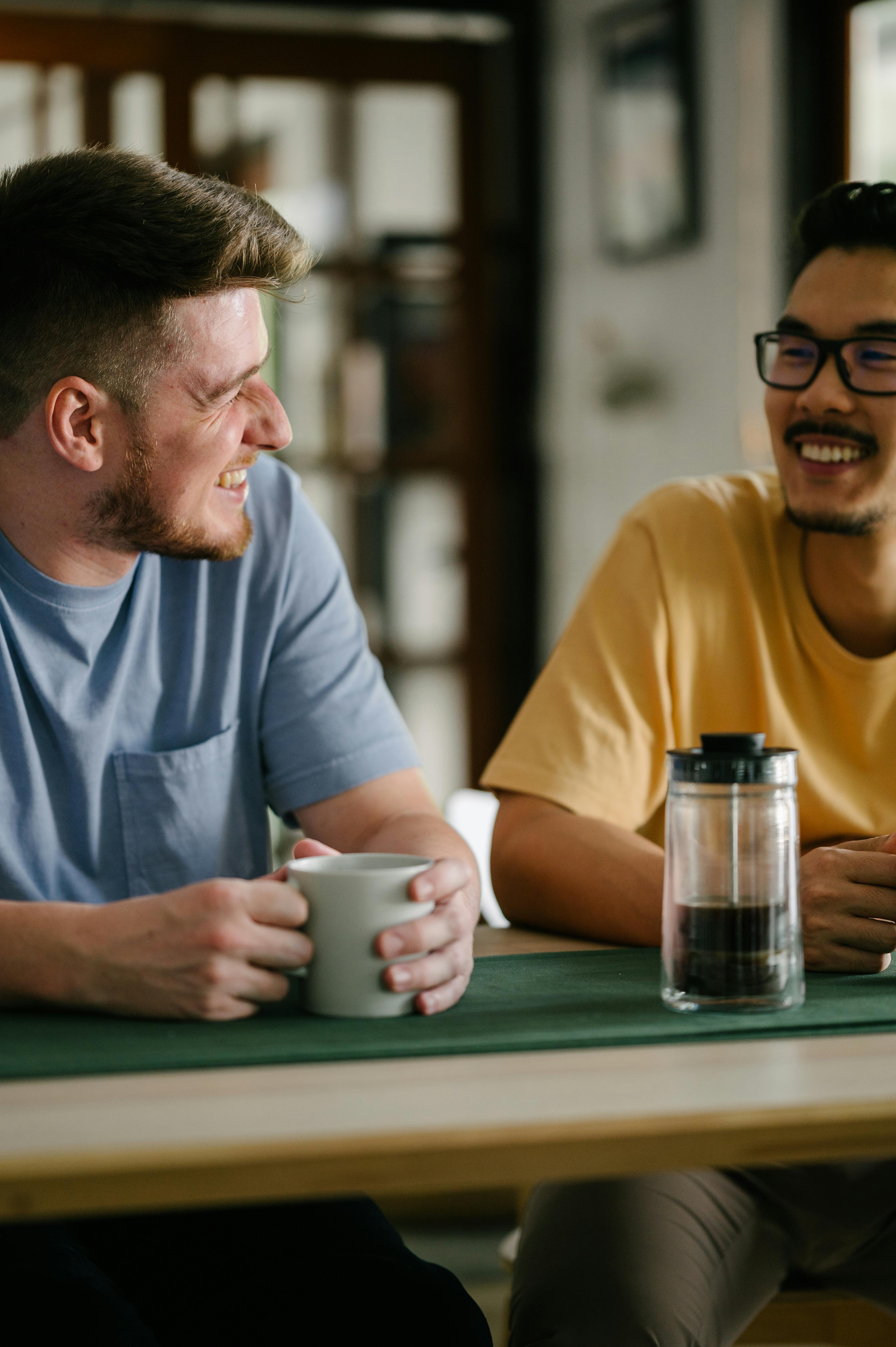 two men smiling facing each other