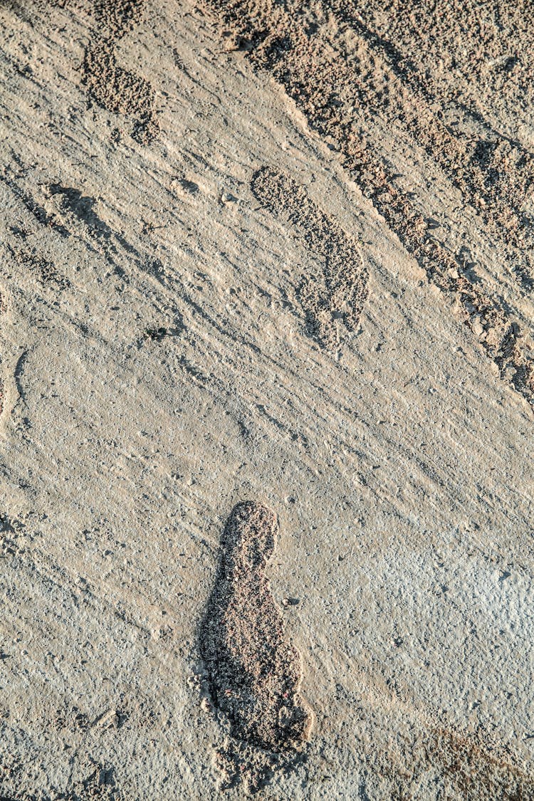 Footsteps On Concrete Floor