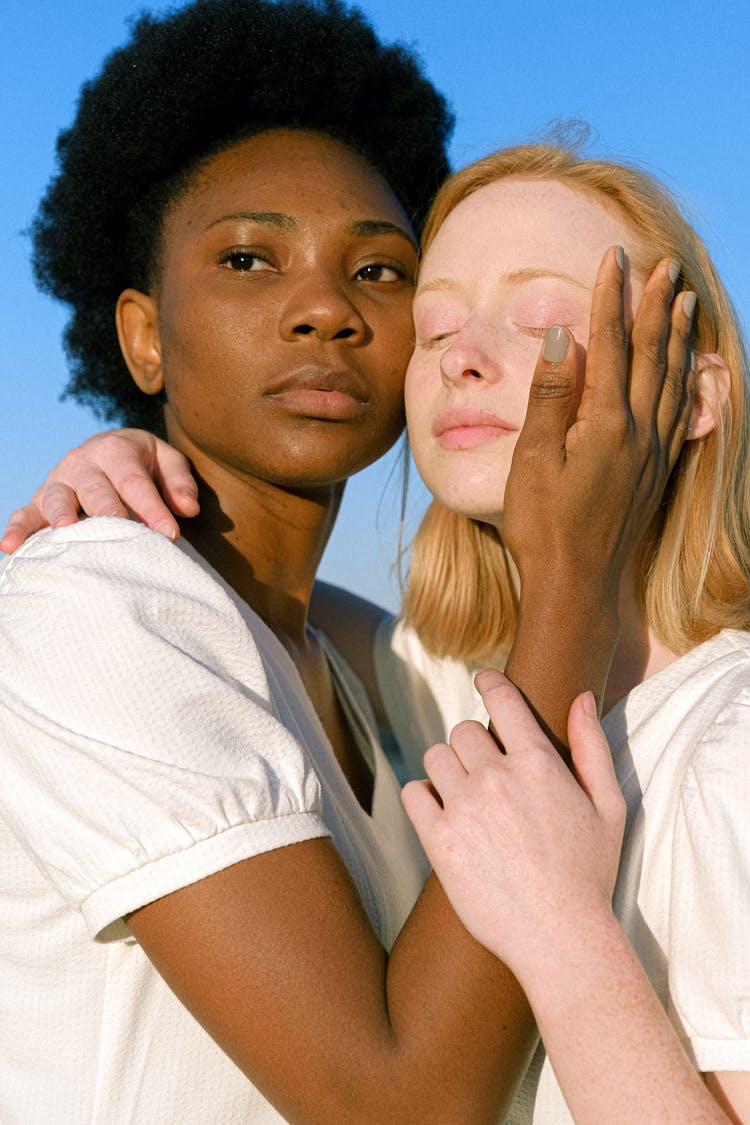 Women Wearing White Tops Posing