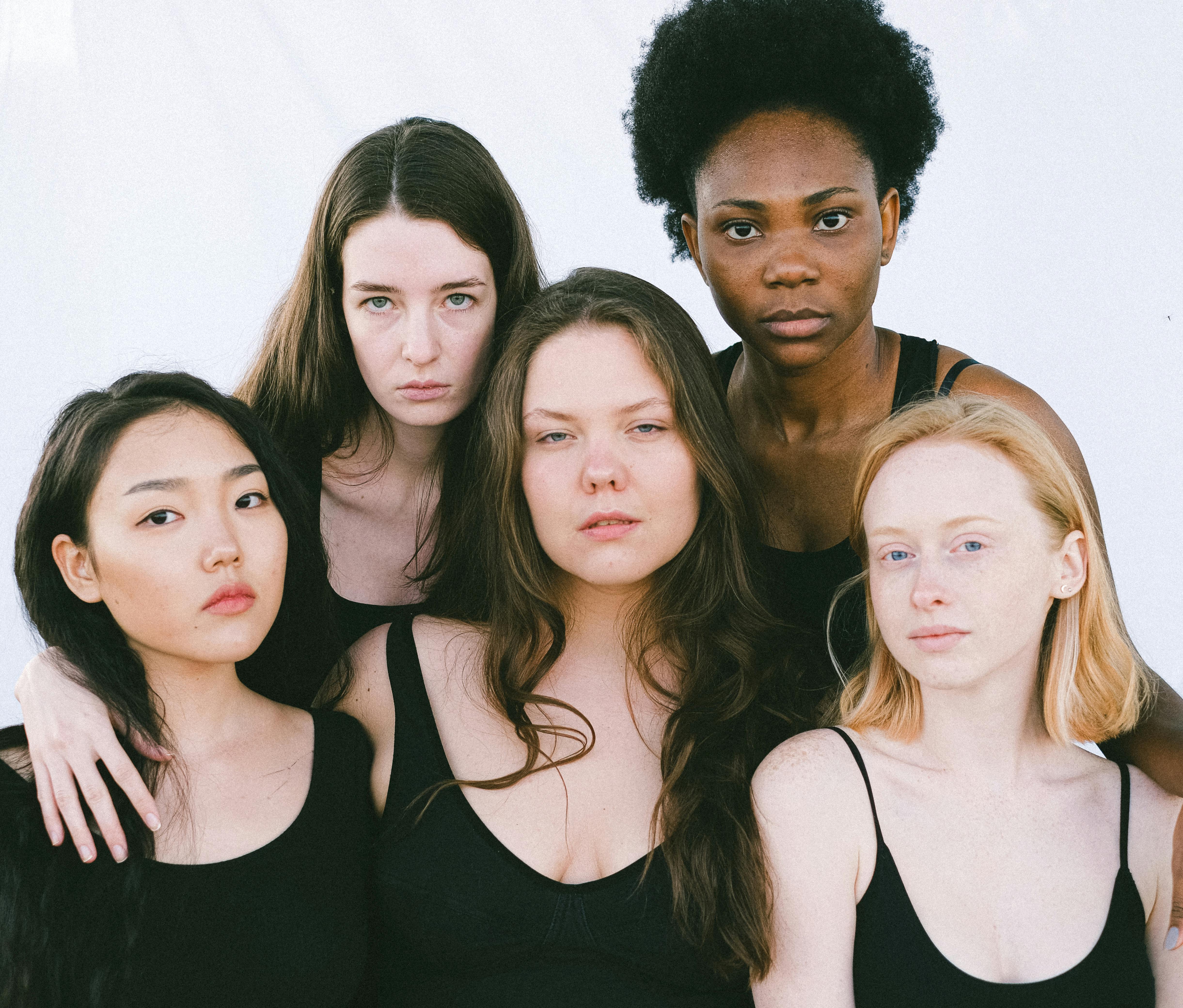 Friends Holding Hands In A Supportive Circle