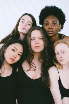 Portrait of a diverse group of women expressing unity and empowerment.