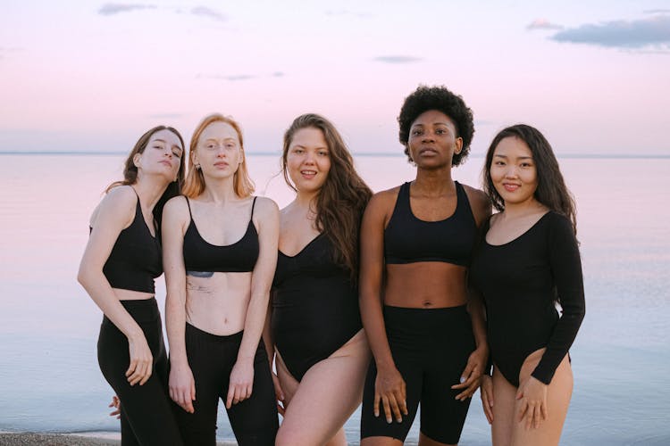 Group Of Women Standing Near Beach