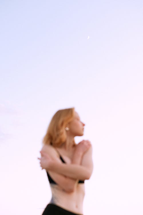 Selectvie Focus Photo of Woman Under Gradient Sky 