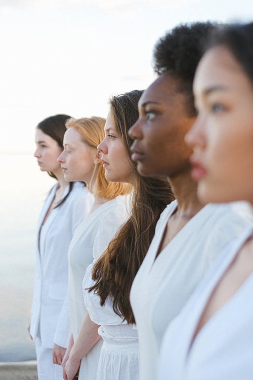 Photo of Beautiful Women in White Outfit