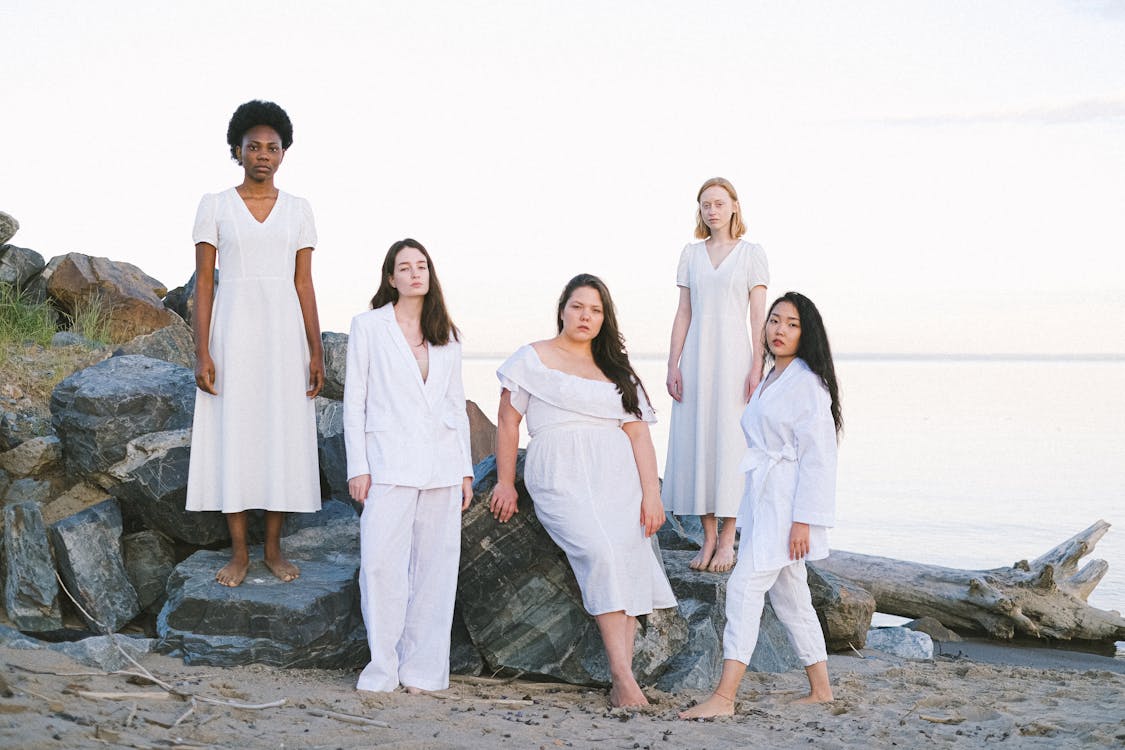 Free Group of Women Standing at the Beachside Stock Photo