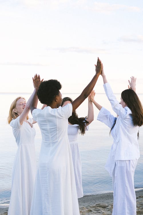 Women in White Dress Dancing on Beach