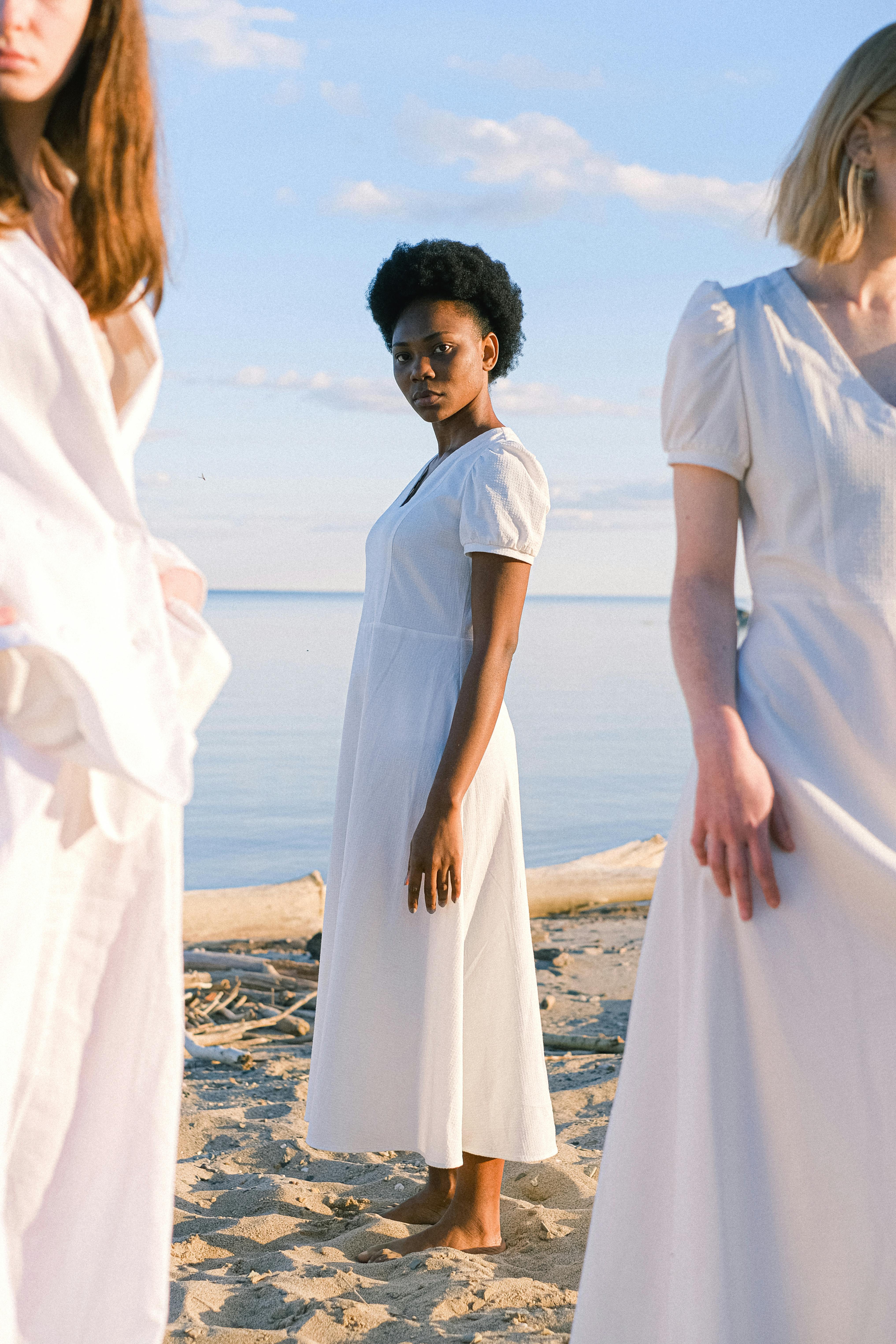 photo of woman wearing white dress