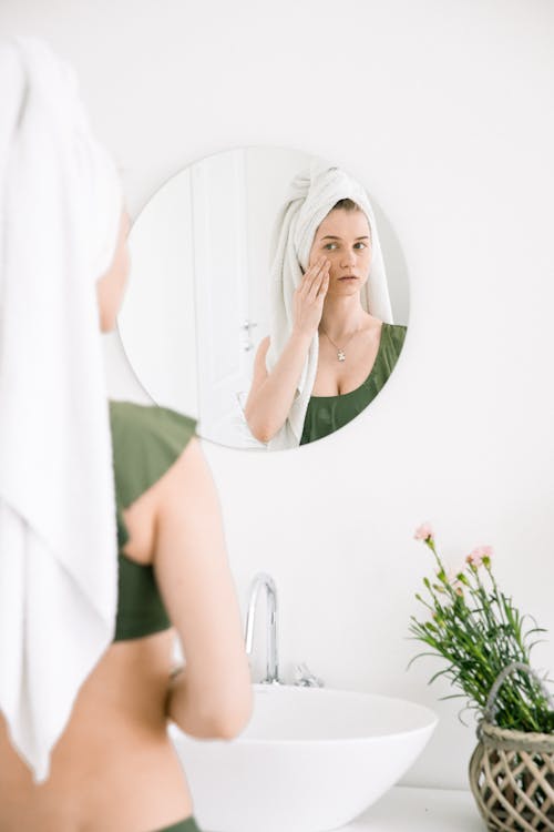 Free Photo Of Woman Looking In The Mirror Stock Photo