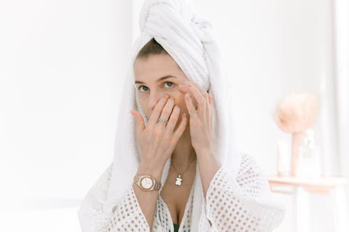 Free Woman in White Head Towel Applying Eye Patch Stock Photo