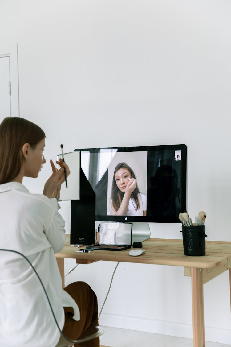 Woman Watching A Makeup Tutorial